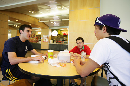students eating fast food in the cafeteria
